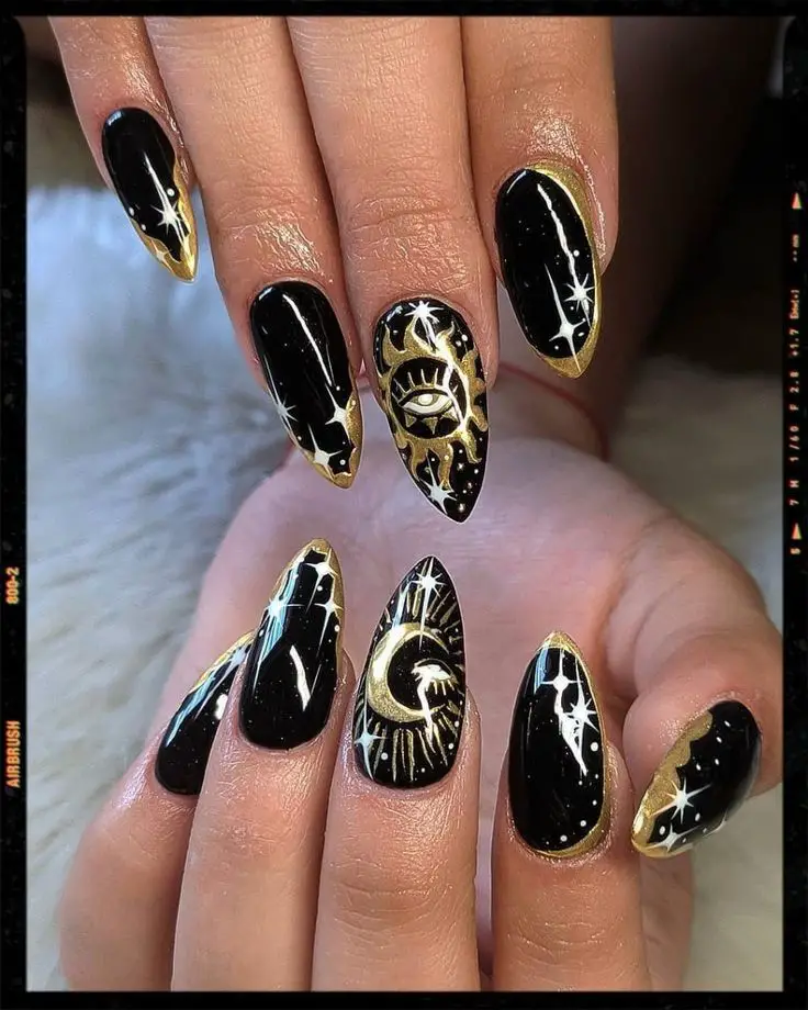 Black and gold nail designs with gold tips