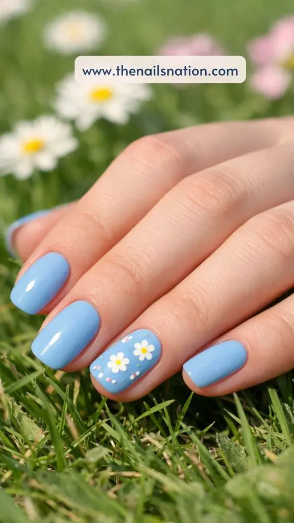 Woman Blue Spring Nail Ideas with Floral Accents